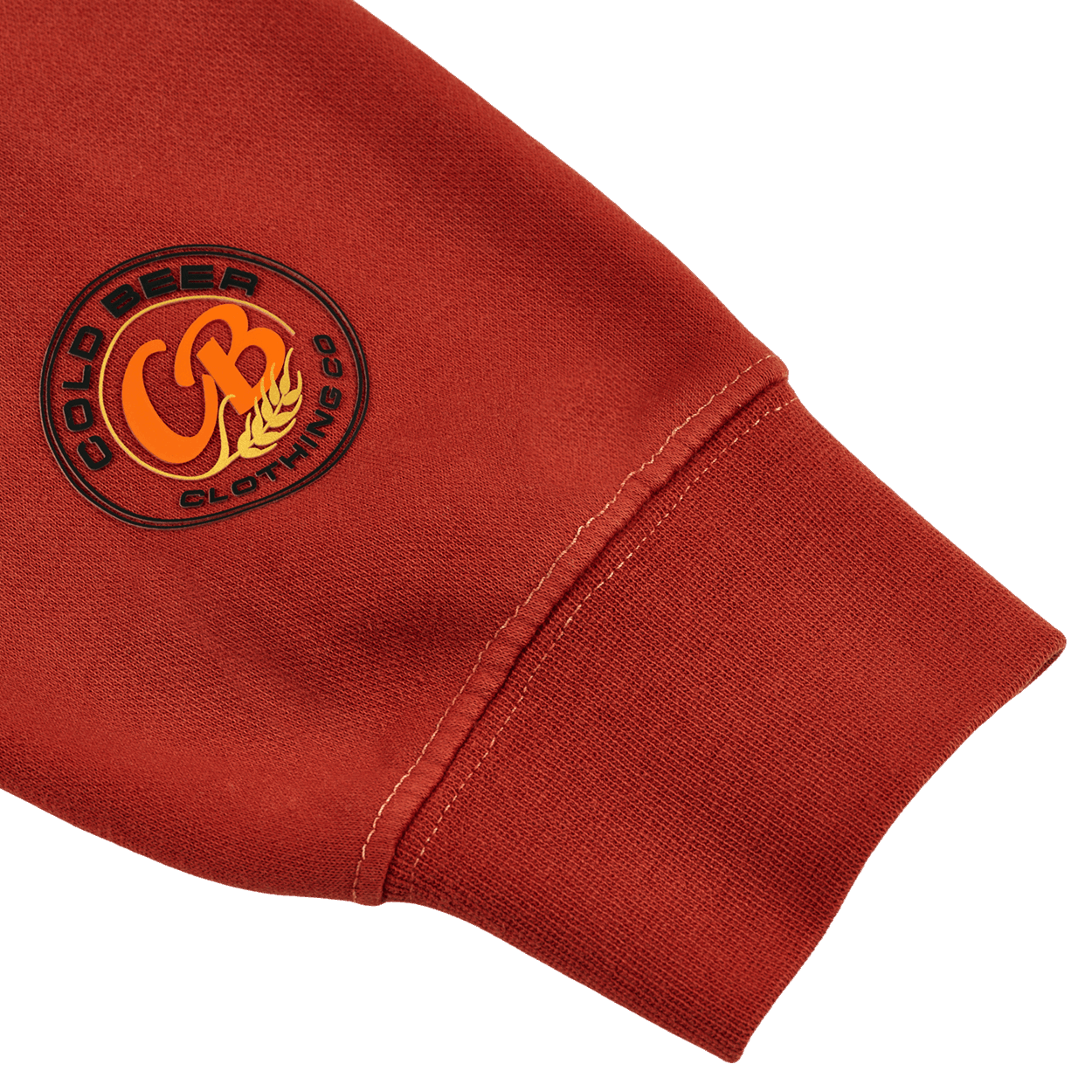 Close-up of the logo on the amber pigment-dyed crewneck