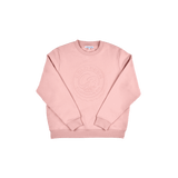 Women's pink sweatshirt showcasing its relaxed fit and soft fleece interior.
