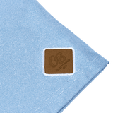 Detailed shot of the Gripp-Tac Patch on the men’s light blue quarter zip sweater for added grip and functionality