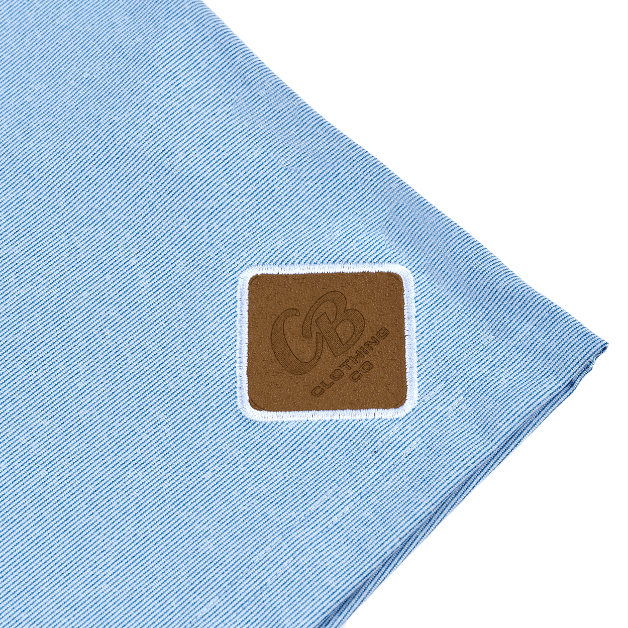 Detailed shot of the Gripp-Tac Patch on the men’s light blue quarter zip sweater for added grip and functionality