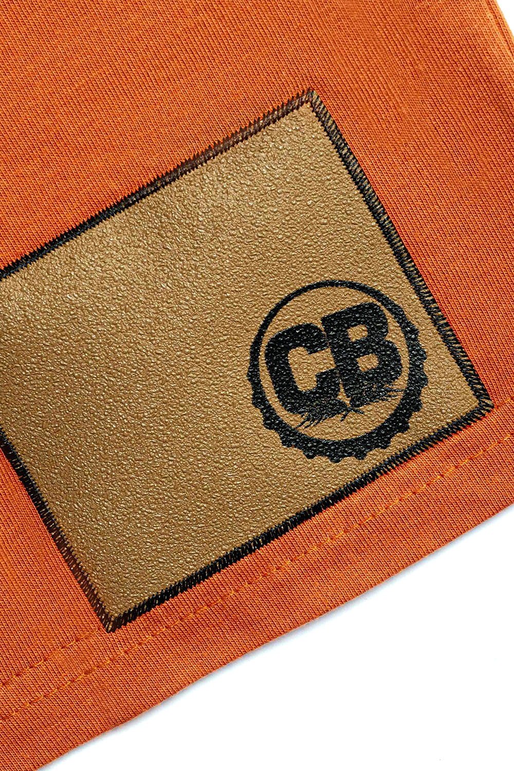 Cold Beer Clothing Moderation Tee Copper Color Up Close View Of Gripp-Tac Patch