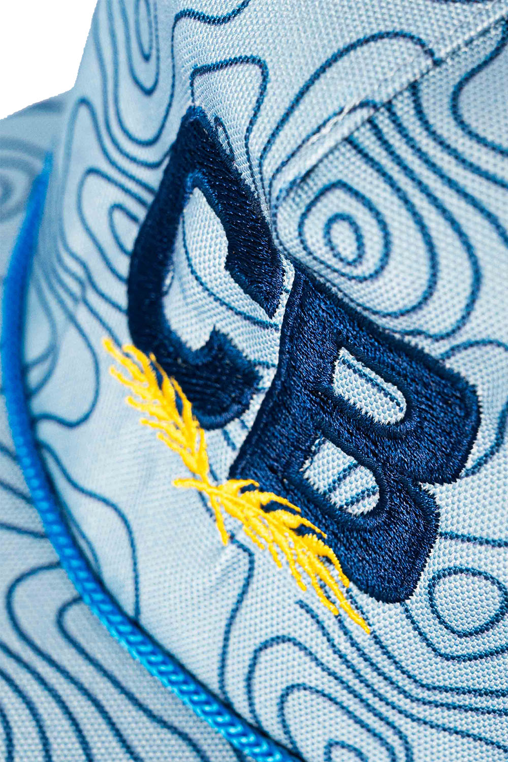 Embroidered Logo Blue Topographic Rope Hat Up Close View Of Logo