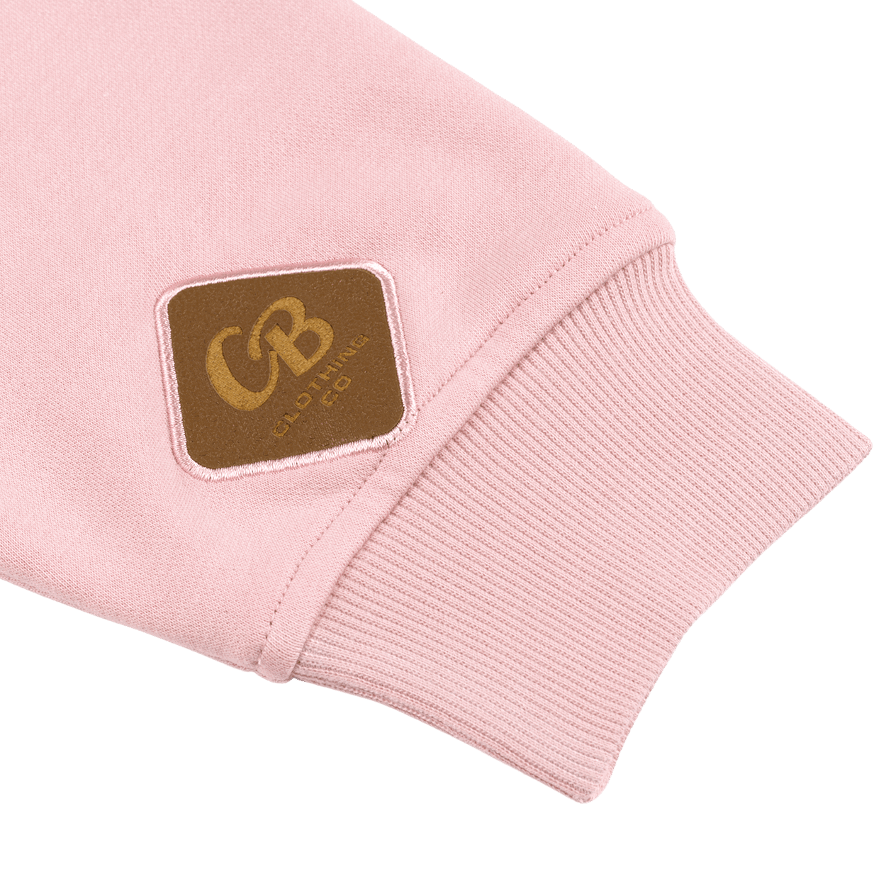 Close-up of the signature Gripp-Tac bottle-opening patch sewn inside the left sleeve of the Pink Crewneck Sweatshirt, just above the cuff seam.