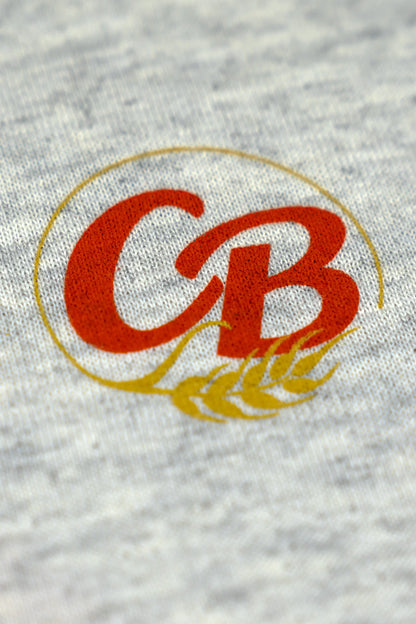 Script Logo Tee Up Close View Of Logo